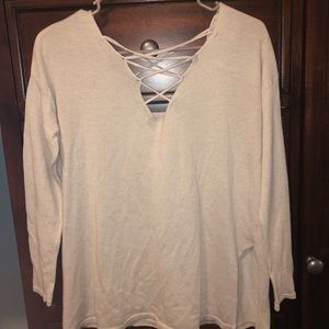 Cream blouse with criss cross detailing